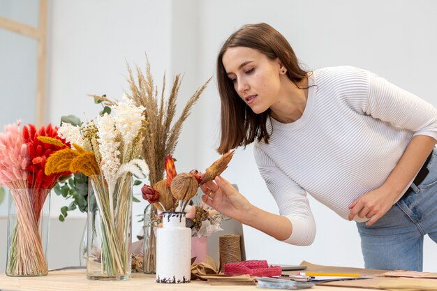 woman arranging flower