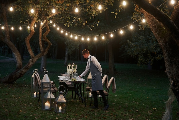 waiter arranging wedding table